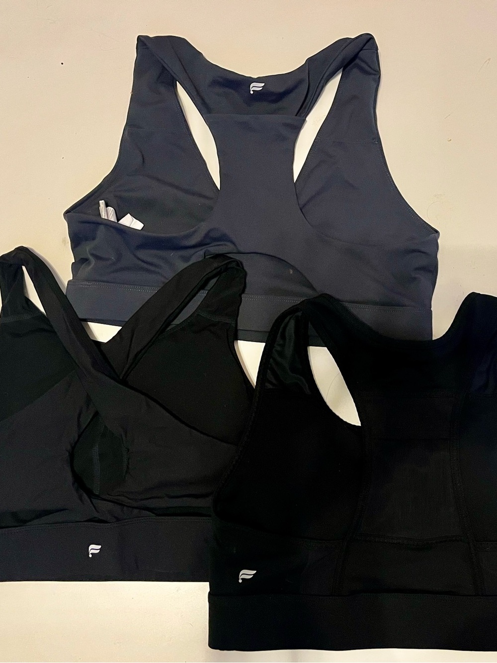 Fabletics Racerback Sports Bras - Black & Charcoal (3-Pack)
